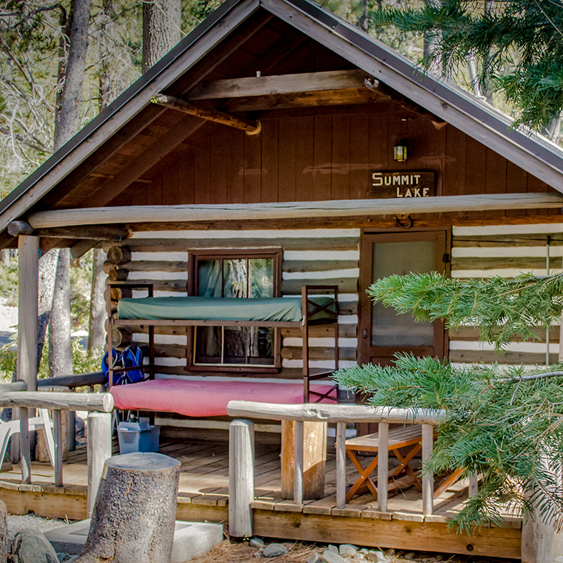 Sardine Lake Resort — Summit Lake cabin with log construction and covered front porch