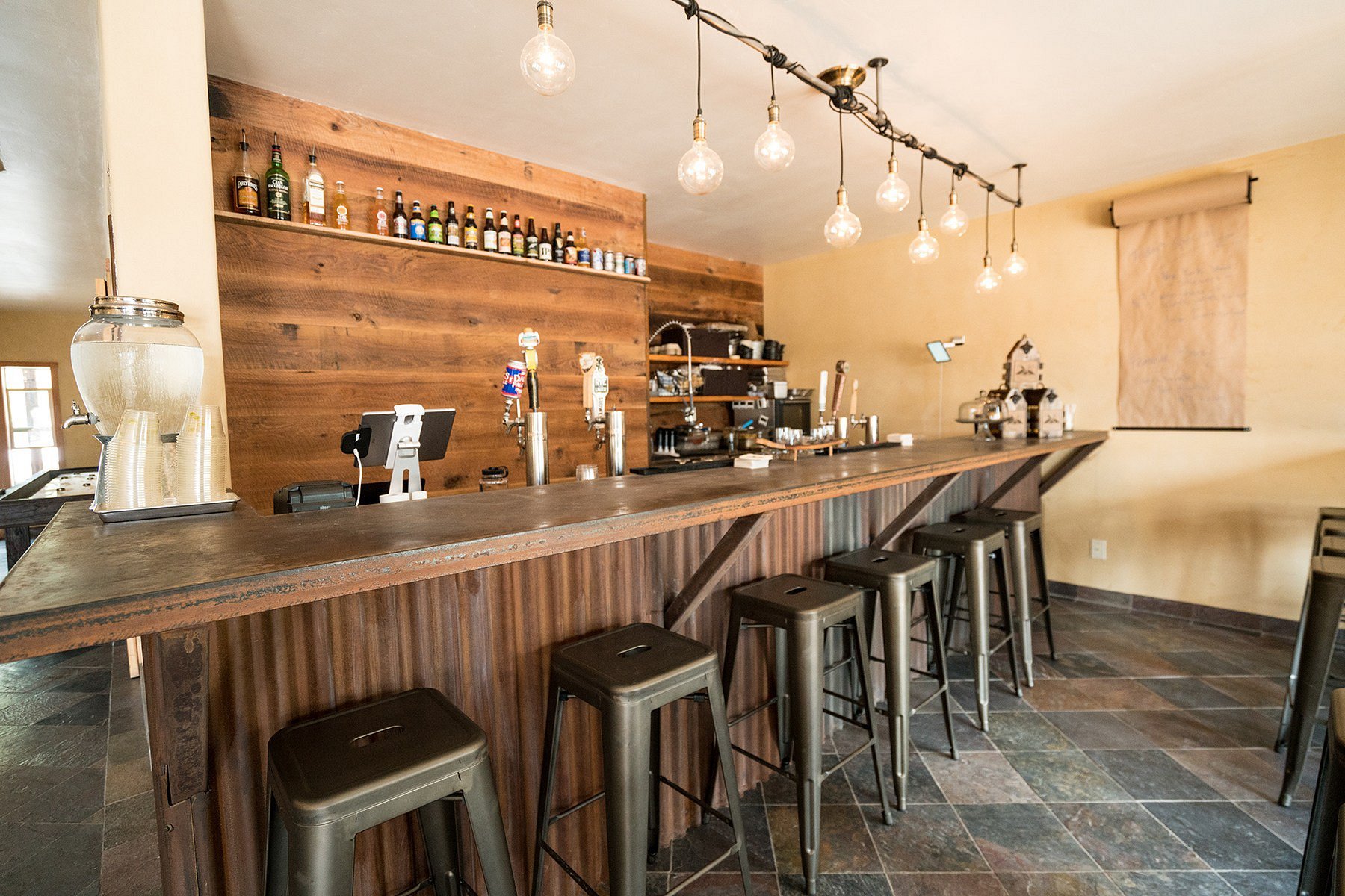 Eureka Peak Brewing Co. — bar counter with Edison bulb lighting and multiple draft taps
