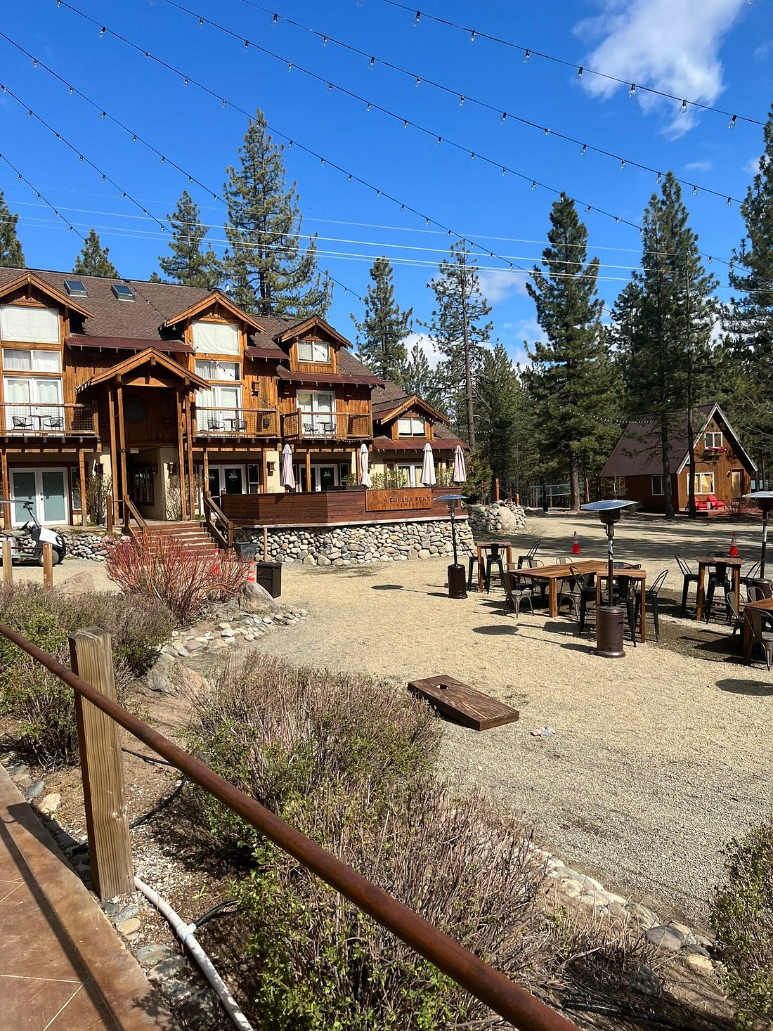 Eureka Peak Brewing Co. — full complex with outdoor seating, cornhole lawn and Chalet View Lodge