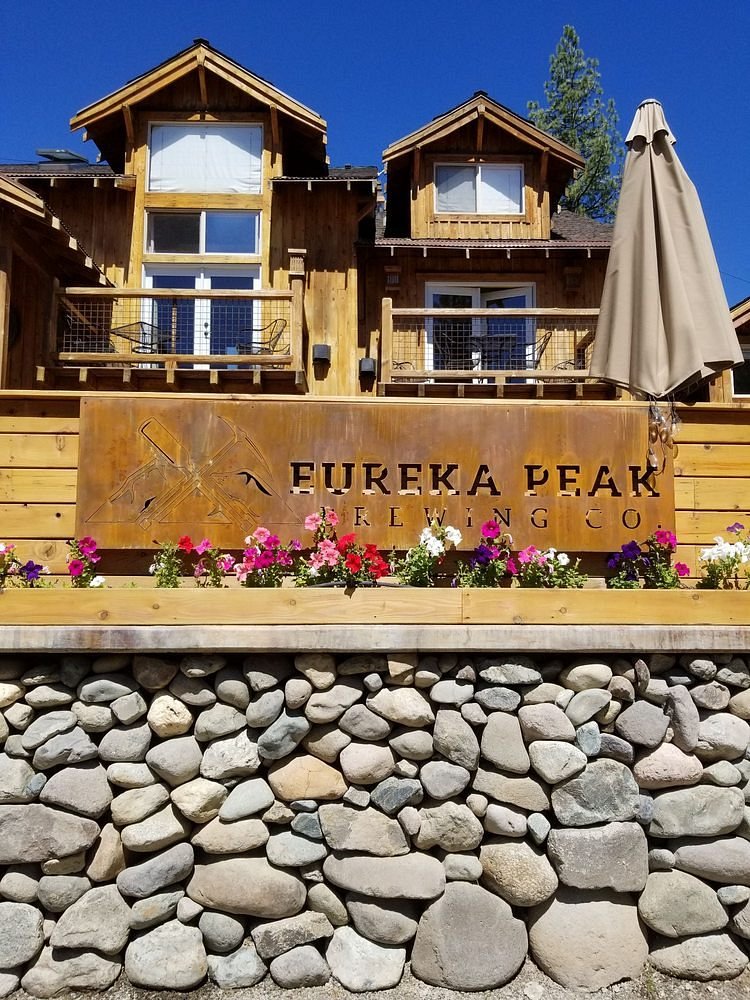 Eureka Peak Brewing Co. — exterior building with copper sign and mountain backdrop, Graeagle CA